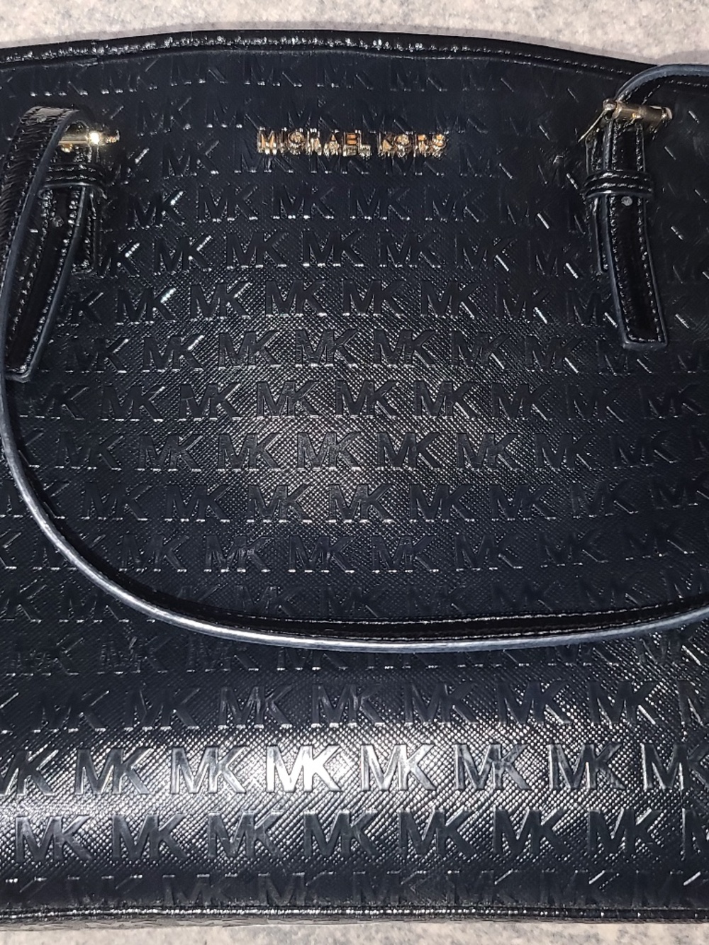 Michael Kors Medium Tote in black patent leather featuring a tonal embossed logo